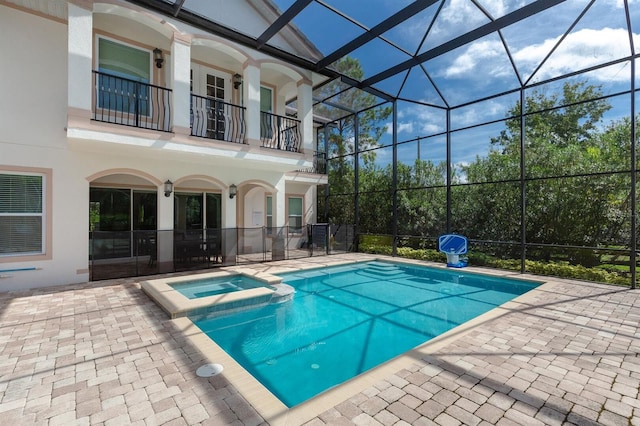 view of pool featuring a lanai and a patio