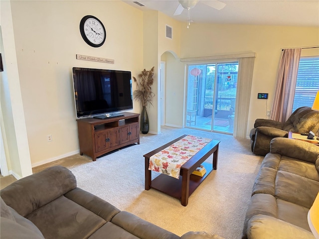 carpeted living room featuring a wealth of natural light, ceiling fan, and vaulted ceiling