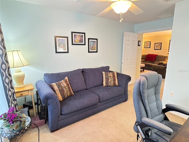 living room with ceiling fan and light carpet