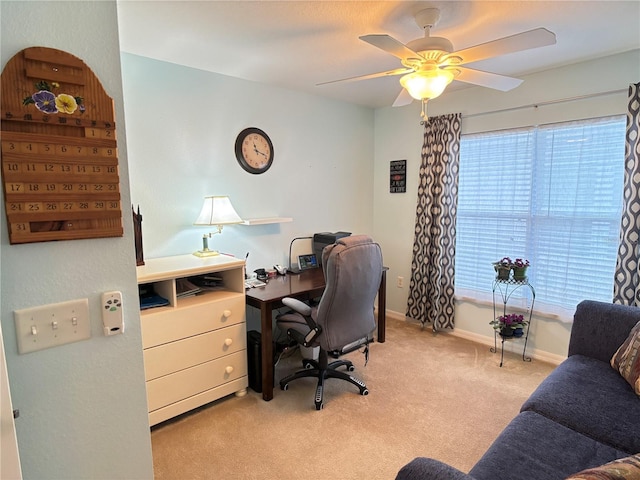 office with a wealth of natural light, light carpet, and ceiling fan