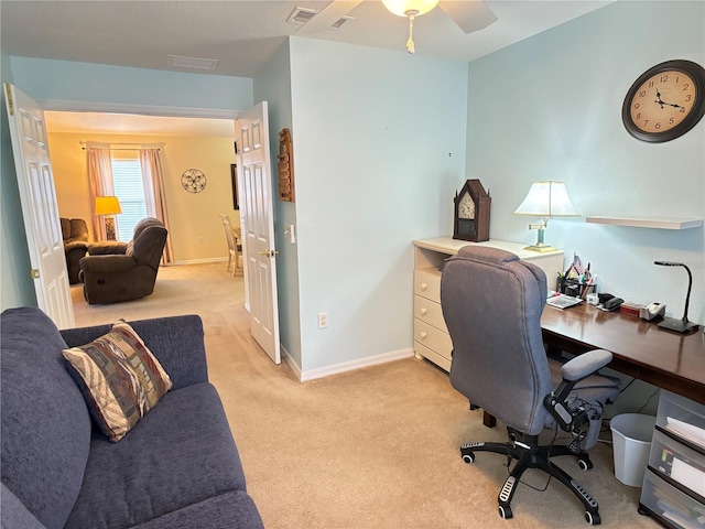 office space featuring ceiling fan and light carpet