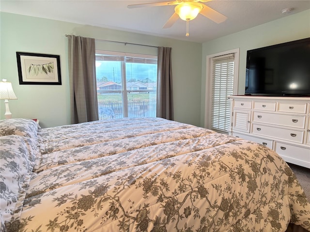 bedroom with ceiling fan and carpet