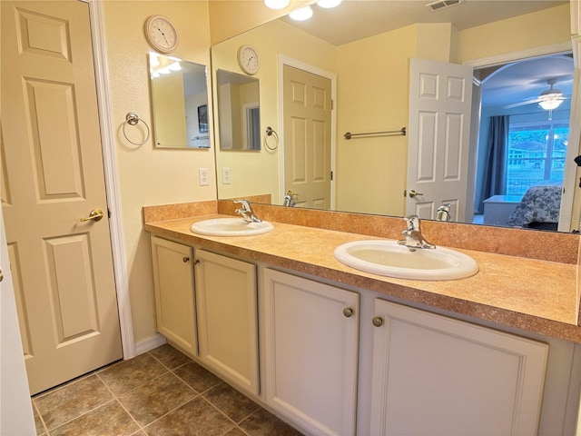 bathroom with tile patterned floors, ceiling fan, and vanity