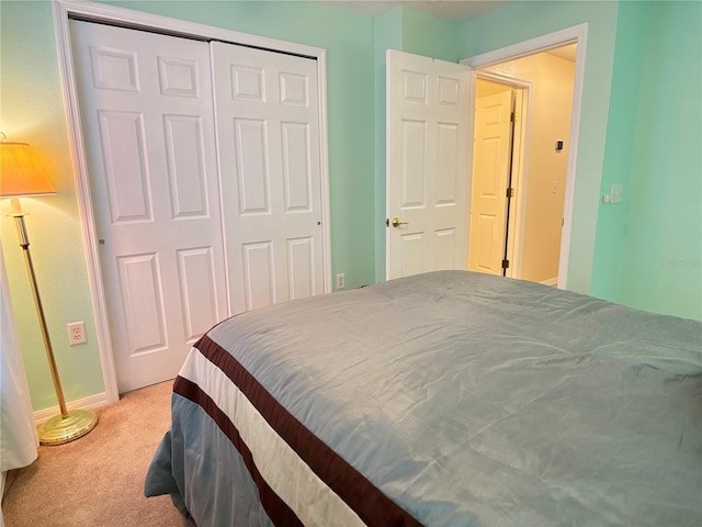 carpeted bedroom featuring a closet