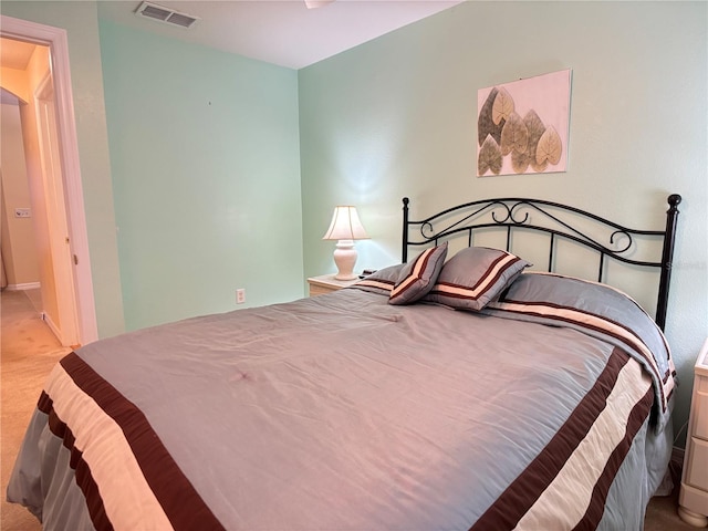 bedroom featuring light carpet