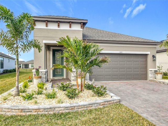 view of front of property with a garage