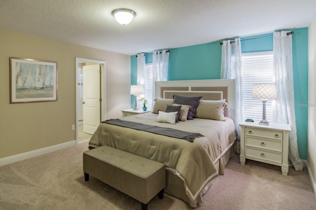 carpeted bedroom featuring a textured ceiling