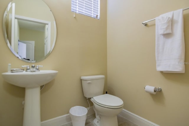 bathroom with tile patterned floors and toilet