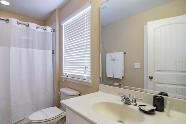 bathroom with vanity, toilet, and a shower with curtain