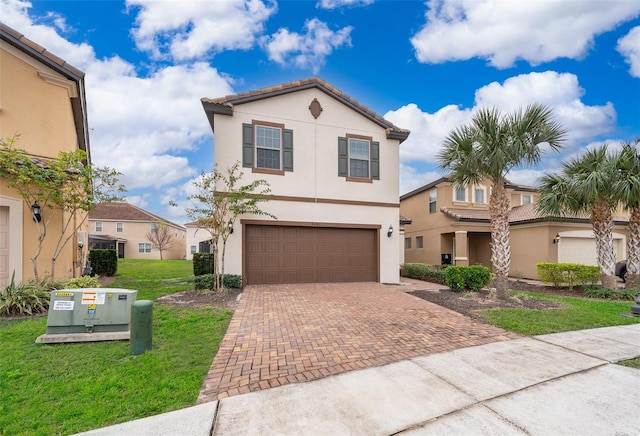 view of front of house with a front lawn and a garage