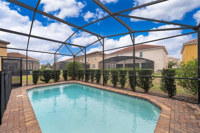 view of swimming pool with a lanai