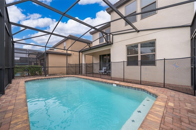 view of pool with a lanai and a patio