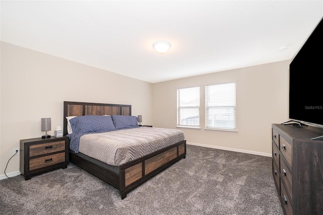 bedroom featuring dark colored carpet