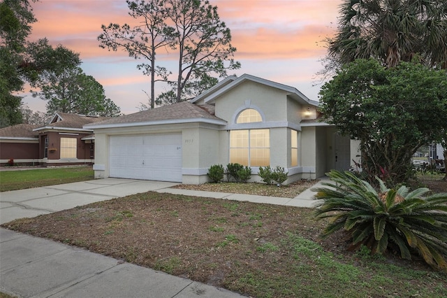 ranch-style house featuring a garage