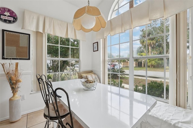 dining area with light tile patterned flooring