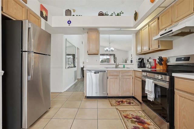 kitchen featuring pendant lighting, light brown cabinets, sink, appliances with stainless steel finishes, and a chandelier