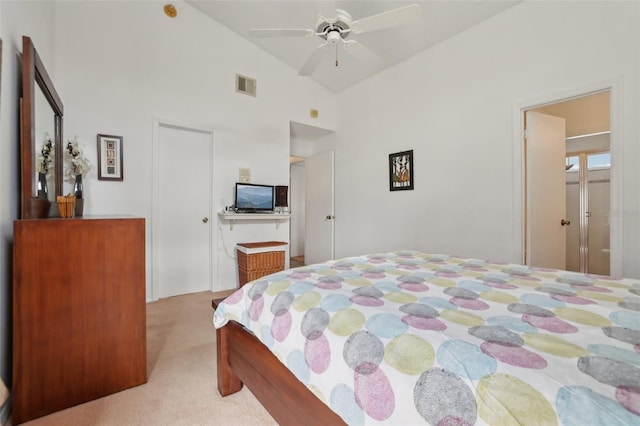 carpeted bedroom featuring ceiling fan and vaulted ceiling