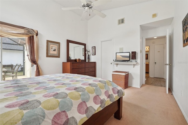 bedroom featuring light carpet, access to outside, vaulted ceiling, and ceiling fan