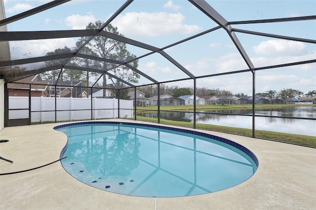 view of pool with a lanai, a water view, and a patio