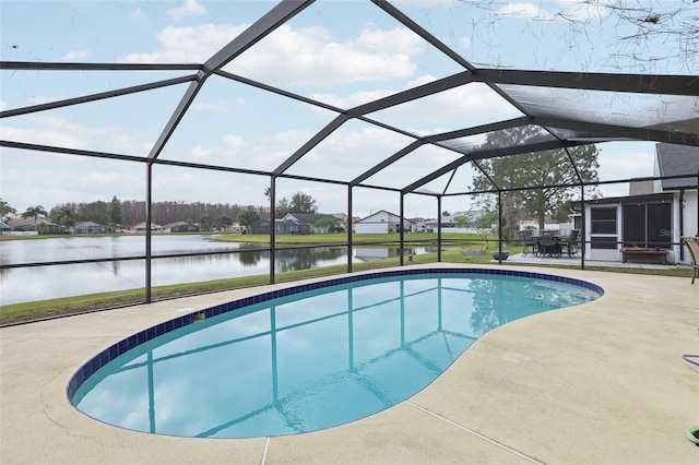 view of swimming pool featuring a patio, a water view, and glass enclosure