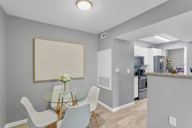 dining area featuring light hardwood / wood-style flooring