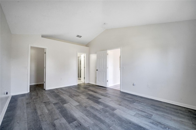 unfurnished room with dark hardwood / wood-style floors and lofted ceiling