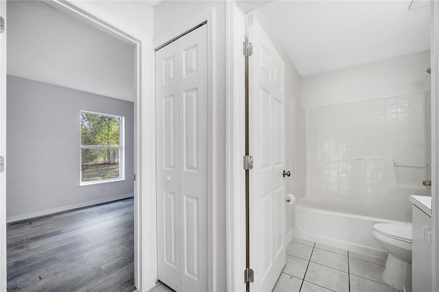 full bathroom featuring tile patterned floors, vanity, toilet, and tub / shower combination