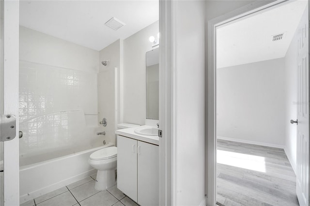 full bathroom featuring tile patterned flooring, vanity, toilet, and shower / washtub combination