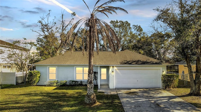 view of front of home featuring a garage and a front yard