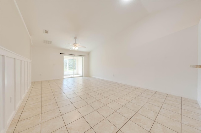 unfurnished room with light tile patterned floors and ceiling fan