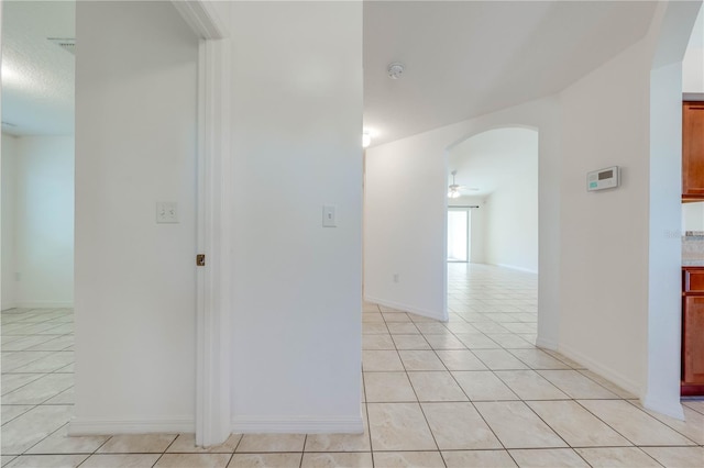 corridor with light tile patterned floors