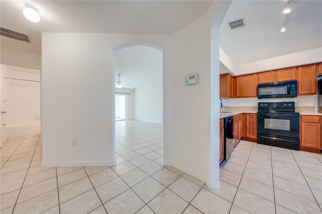 kitchen with ceiling fan, sink, tasteful backsplash, light tile patterned floors, and black appliances