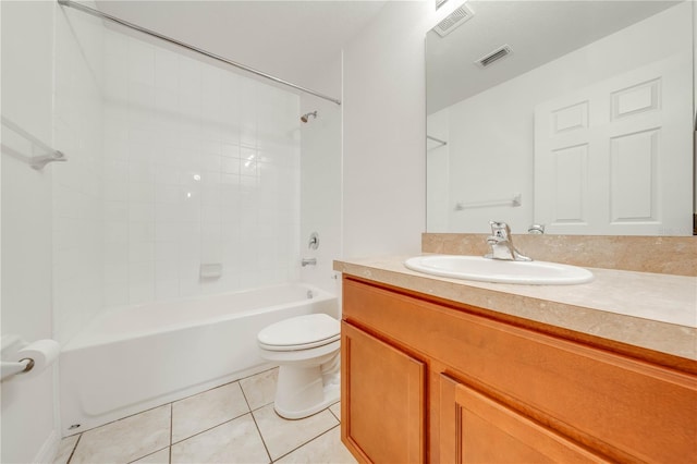 full bathroom featuring toilet, vanity, tile patterned floors, and tiled shower / bath combo