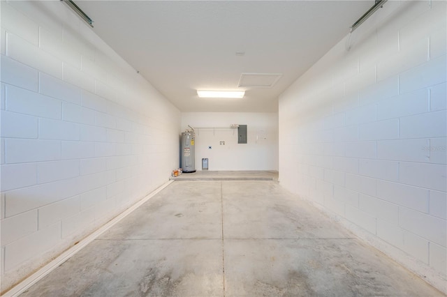 garage with electric water heater and electric panel