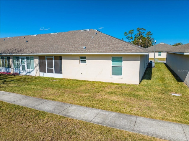 exterior space featuring a yard and central AC unit