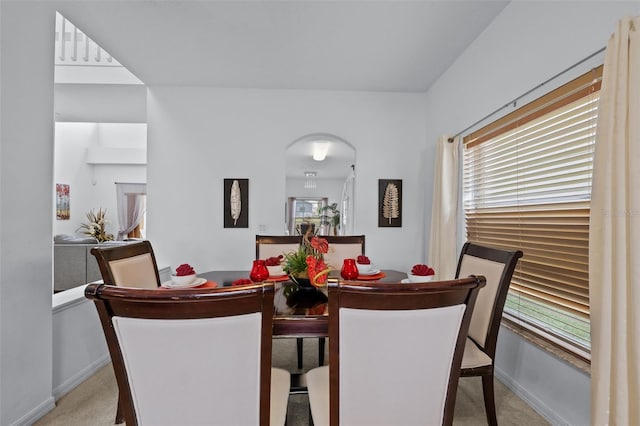 dining room with light carpet