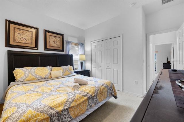 bedroom with dark colored carpet and a closet