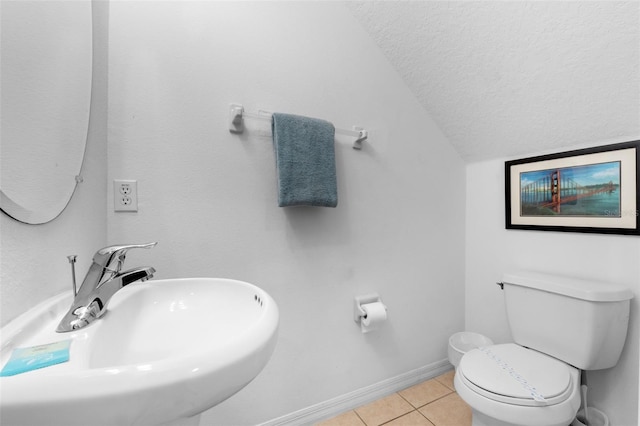 256 Lancaster Dr, Davenport, FL 33897 - half bath with a textured ceiling, tile patterned floors, and lofted ceiling