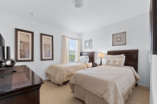 256 Lancaster Dr, Davenport, FL 33897 - bedroom featuring light carpet and baseboards