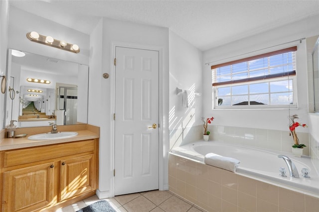 256 Lancaster Dr, Davenport, FL 33897 - bathroom with a garden tub, tile patterned flooring, and vanity