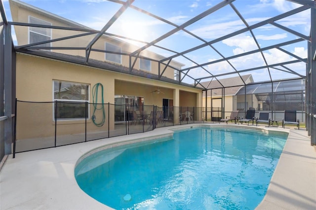 256 Lancaster Dr, Davenport, FL 33897 - view of swimming pool featuring a patio, glass enclosure, and ceiling fan