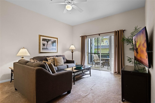 carpeted living room featuring ceiling fan