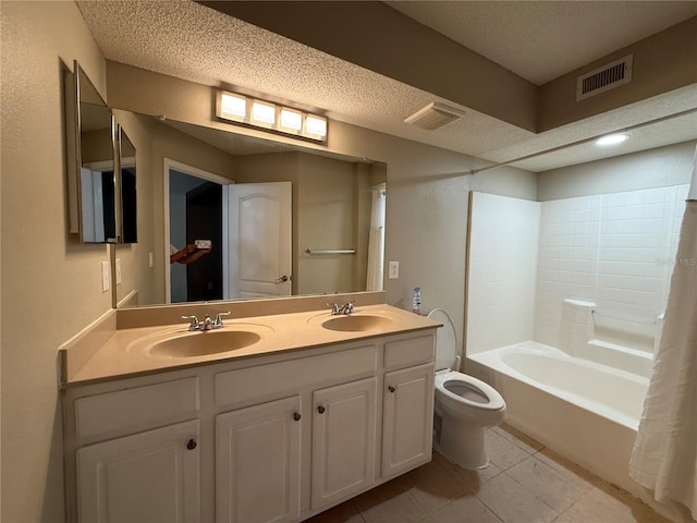 full bathroom with toilet, a textured ceiling, shower / bath combo with shower curtain, tile patterned floors, and vanity