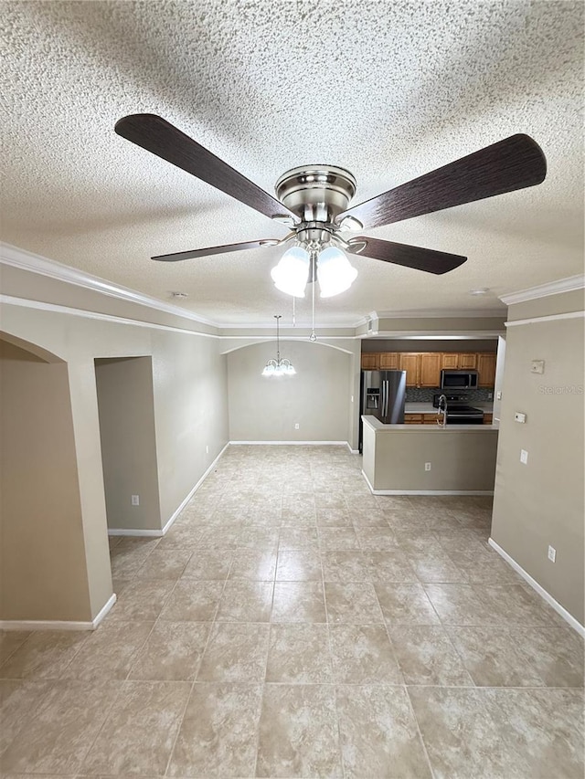 interior space with ceiling fan with notable chandelier, a textured ceiling, and crown molding