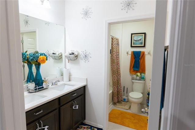 full bathroom with tile patterned floors, shower / tub combo with curtain, vanity, and toilet