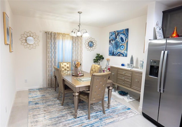 dining space featuring a chandelier