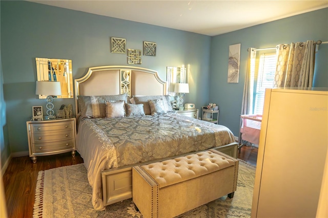 bedroom with dark wood-type flooring