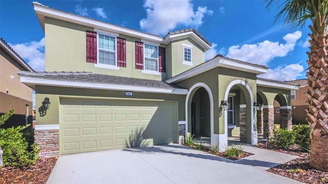 view of front of property featuring covered porch and a garage