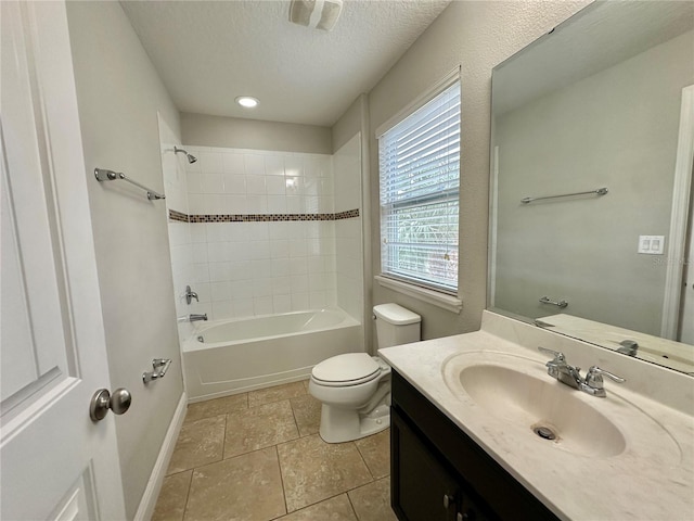 full bathroom with tile patterned flooring, tiled shower / bath, a textured ceiling, toilet, and vanity