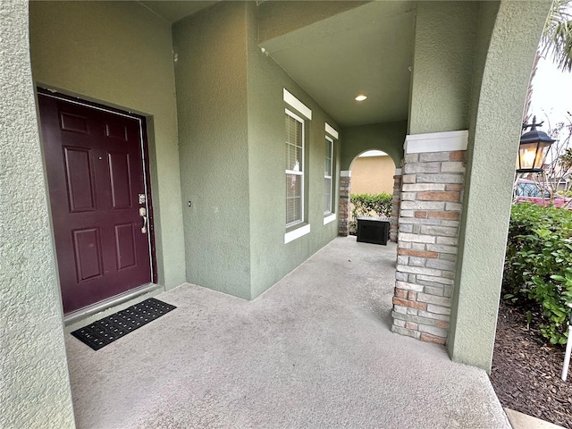 doorway to property featuring covered porch